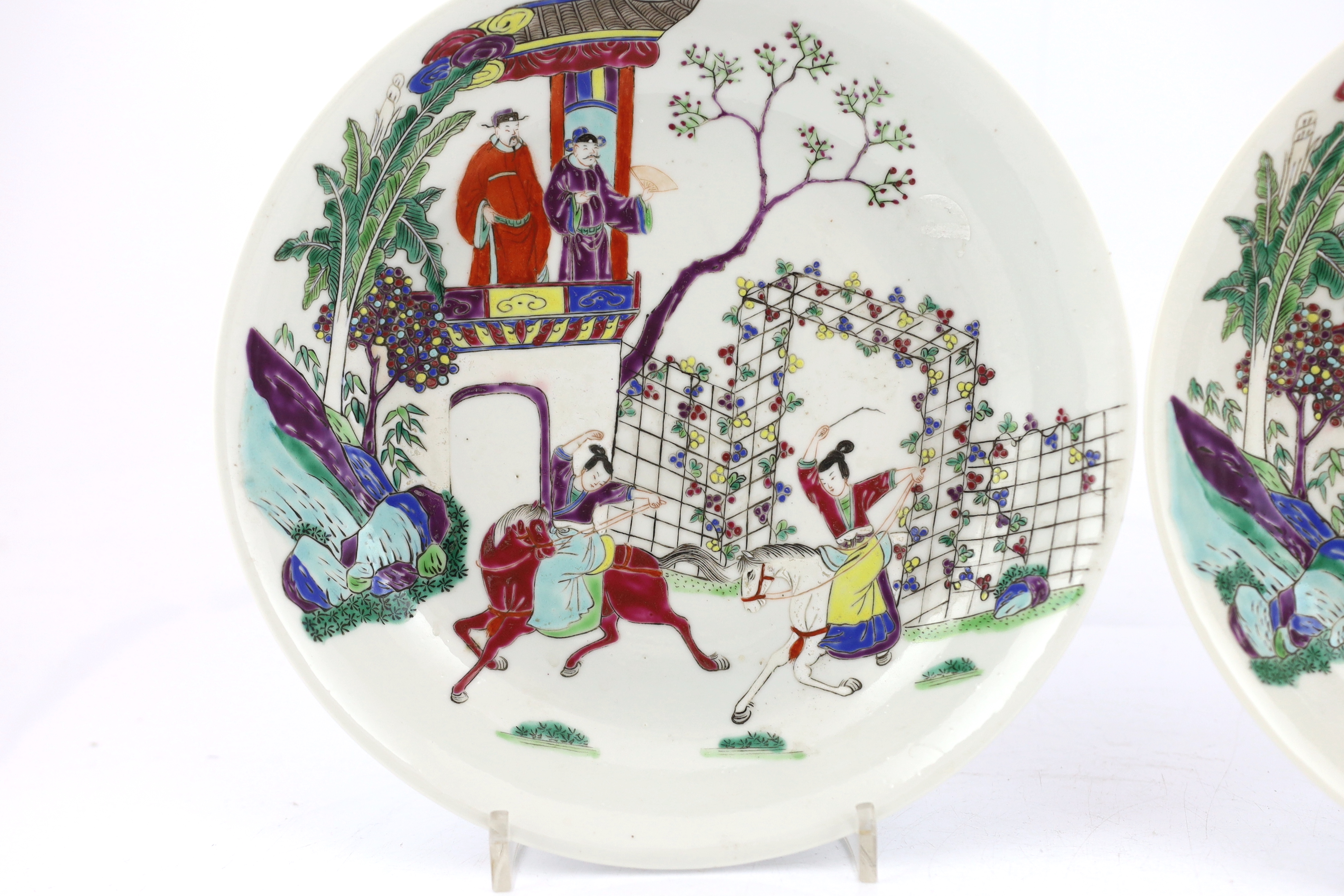 A pair of Chinese famille rose saucer dishes, Yongzheng mark but first half 19th century, one dish has a short hairline crack